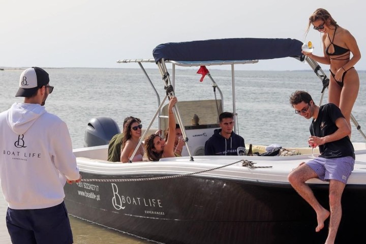 Boatlife boat docked at Faro while excited passengers step off